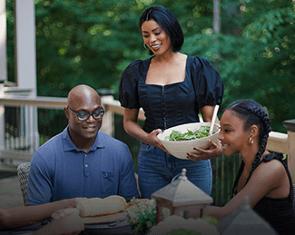 Family Eating Dinner Outside