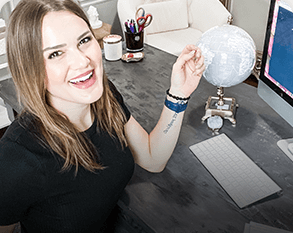 Woman Smiling At Desk