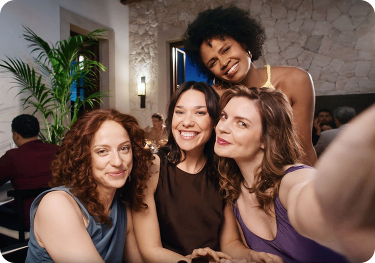 Actor portrayal of a group of women taking a selfie