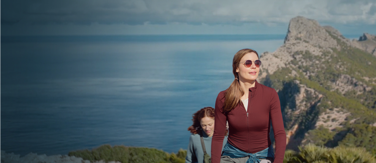 Actor portrayal of two women hiking in a scenic place