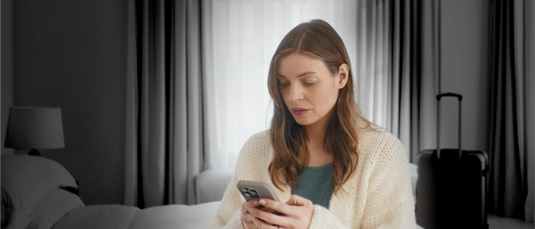 Actor portrayal of woman looking at her phone