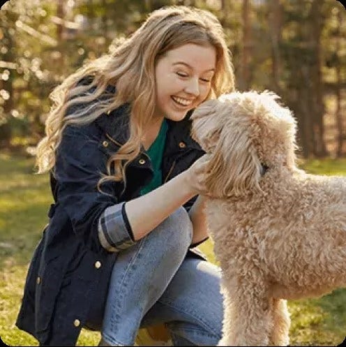 Actor portrayal of a woman petting a dog